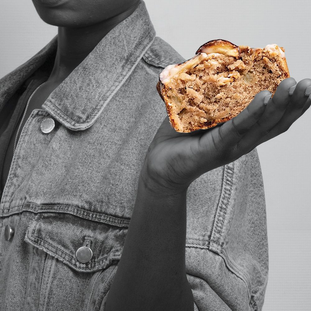 a black women holding apple cinnamon cake